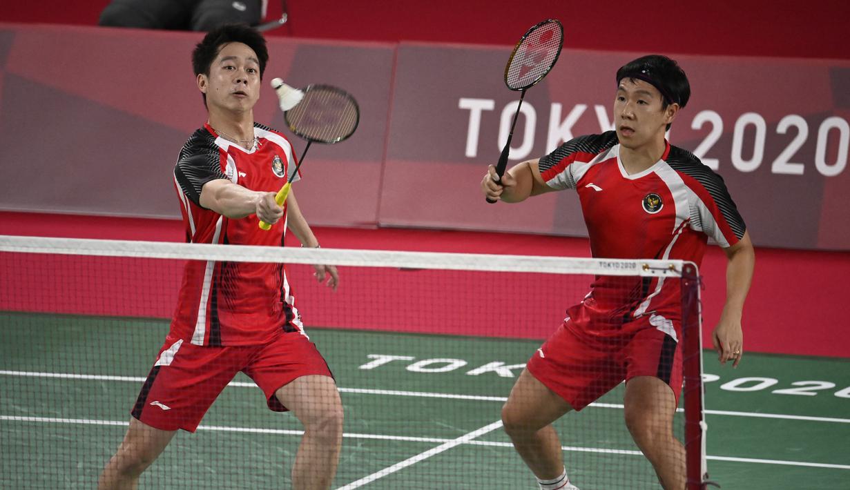 Kevin Sanjaya/Marcus Gideon. mengawalai Olimpiade Tokyo dengan kemenangan. (foto: AFP)